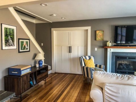 Living room with doors leading to bedroom 
