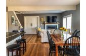 Breakfast bar on your left, dining area on your right, living room straight ahead. 