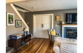 Living room with doors leading to bedroom 