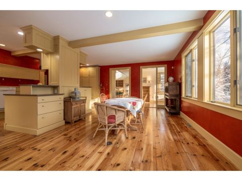 Family room, with views of the expansive property, and access to a private office