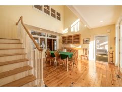Accessed from both the living room and family room, the centrally-located dining room 