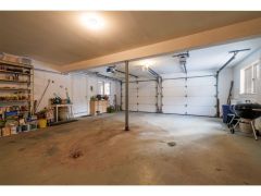 The walk-out basement, easily accessed from the main level, has additional storage, a heated 2-car garage, and a large space ideally suited for an art studio, office, or TV room.